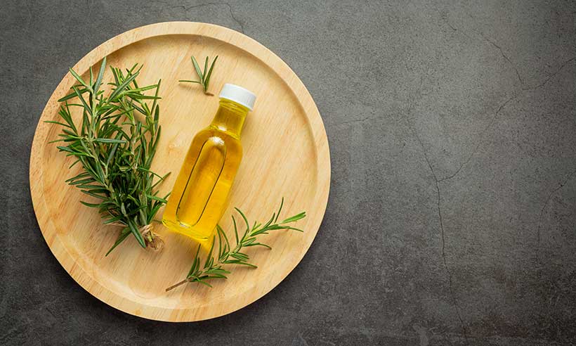 can-rosemary-oil-regrow-hair-rosemary-oil-bottle-with-rosemary-plants